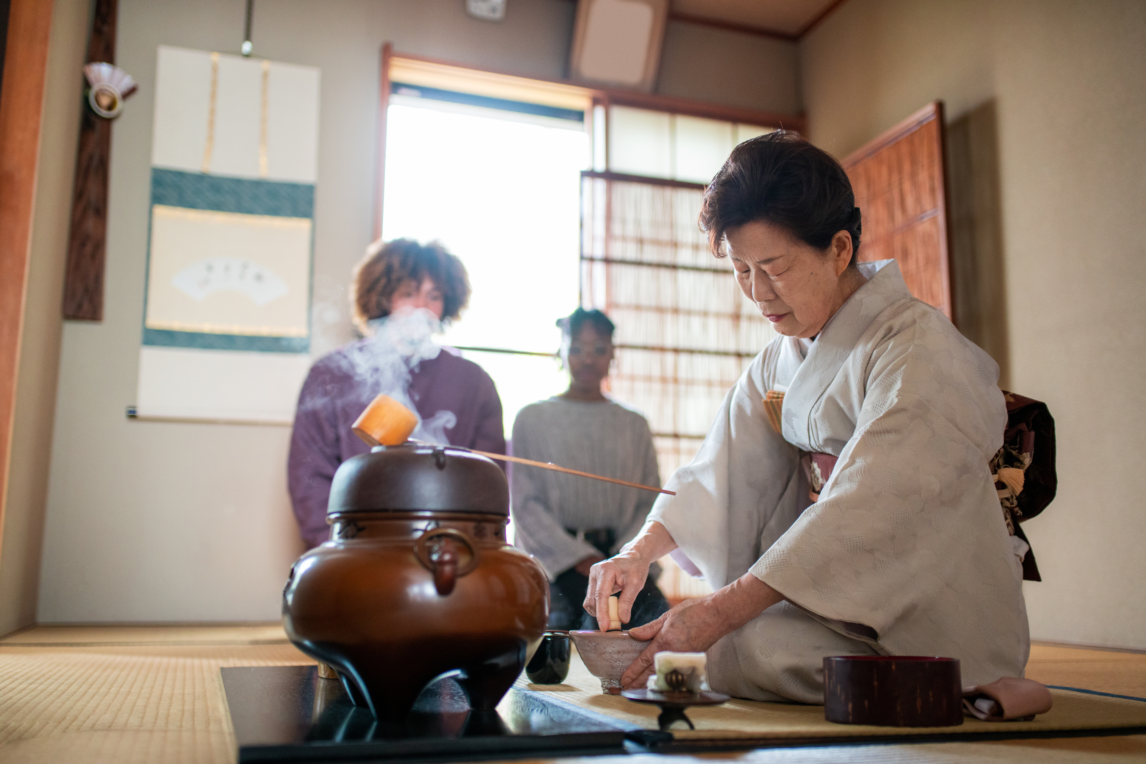 Japanese tea master whisking matcha tea
